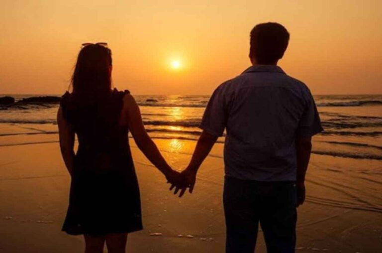 Couple holding hands at sunset, symbolising relationship healing, hope and support through marriage counselling.